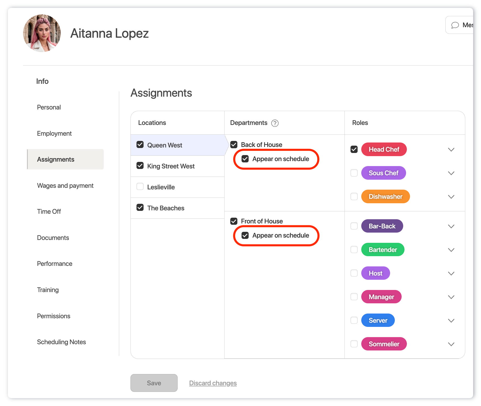 Employee profile Assignments page showing Queen West selected, with “Appear on schedule” enabled for both the Back of House and Front of House departments.